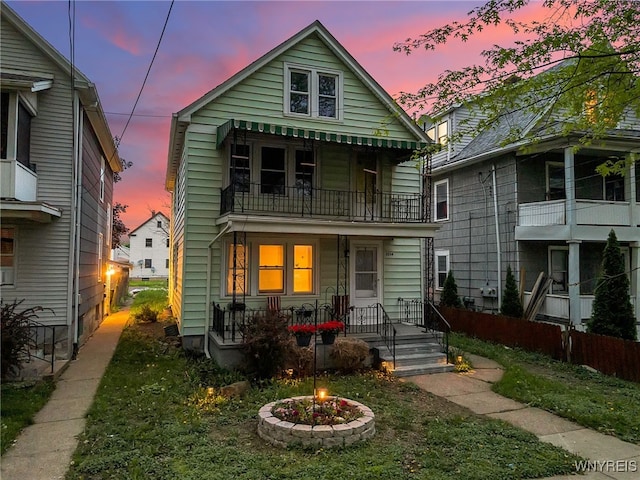 2254 Grand Ave, Niagara Falls, NY 14301 - view of front facade with a balcony, a fire pit, and a porch
