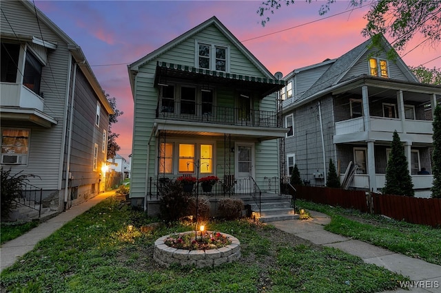 2254 Grand Ave, Niagara Falls, NY 14301 - view of front facade with a balcony, covered porch, an outdoor fire pit, and cooling unit