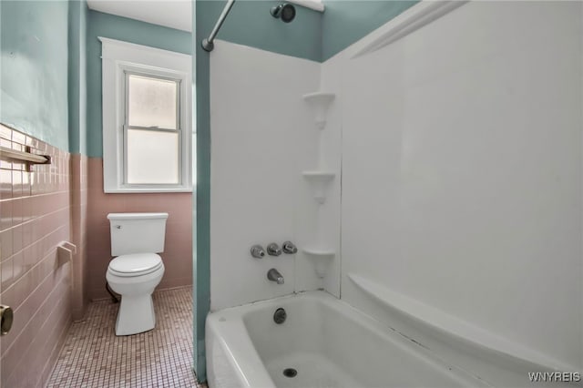 2254 Grand Ave, Niagara Falls, NY 14301 - full bathroom with toilet, tile patterned floors, a wainscoted wall, washtub / shower combination, and tile walls