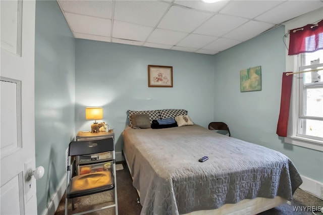2254 Grand Ave, Niagara Falls, NY 14301 - carpeted bedroom with a paneled ceiling, multiple windows, and baseboards