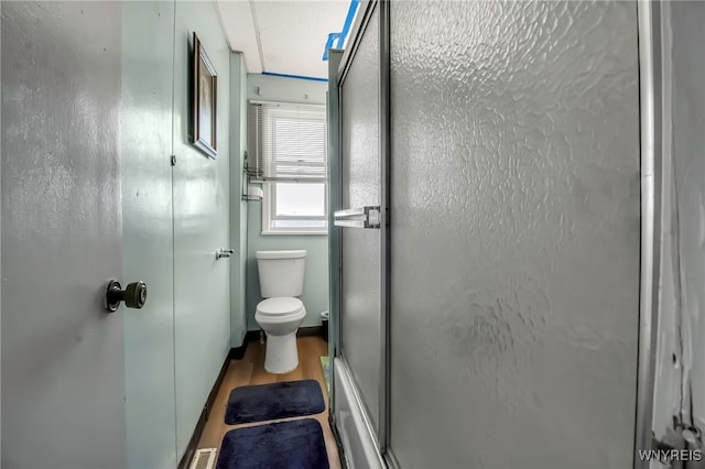 2254 Grand Ave, Niagara Falls, NY 14301 - bathroom with a shower with shower door, toilet, and wood finished floors