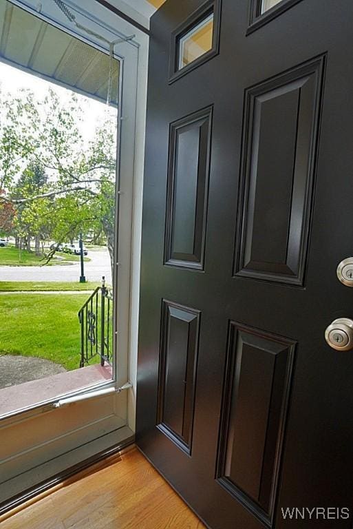 entryway with plenty of natural light and light wood finished floors