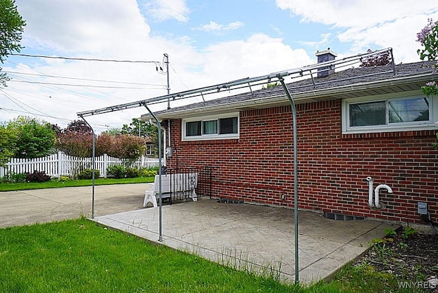 view of patio / terrace featuring fence