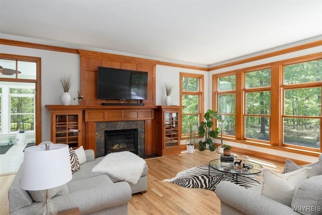 5032 Rockledge Dr, Clarence, NY 14031 - living area featuring a large fireplace, light wood-style floors, and ornamental molding