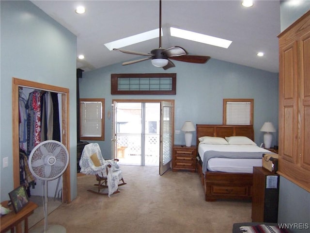 bedroom with a skylight, lofted ceiling, carpet flooring, recessed lighting, and a ceiling fan