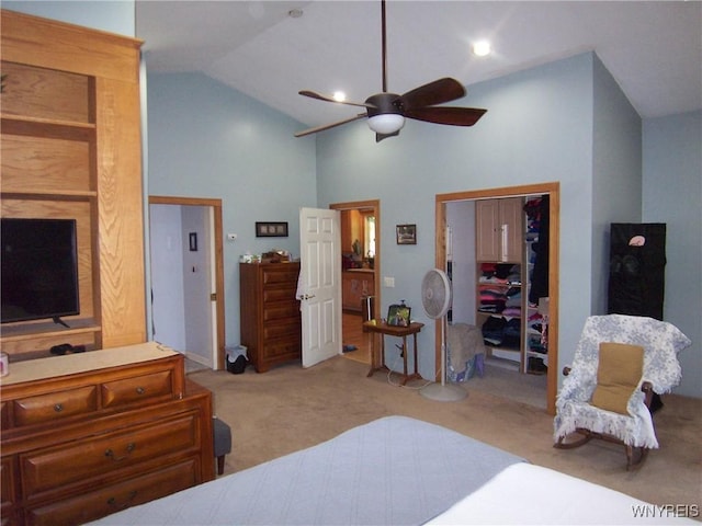 carpeted bedroom with high vaulted ceiling, ceiling fan, and a closet