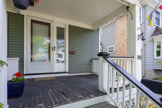 141 Mulberry St, Rochester, NY 14620 - view of exterior entry featuring brick siding, a surveillance system, and french doors