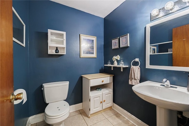 141 Mulberry St, Rochester, NY 14620 - bathroom with toilet, tile patterned flooring, and baseboards