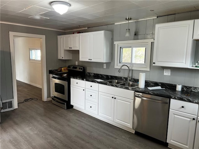 16-20 Cummings St, Rochester, NY 14609 - kitchen featuring stainless steel appliances, a sink, white cabinetry, dark wood-style flooring, and crown molding