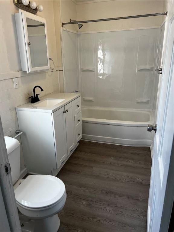 16-20 Cummings St, Rochester, NY 14609 - full bath with wood finished floors, toilet, washtub / shower combination, and vanity