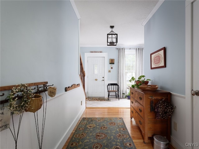 127 W St, Rutland, NY 13612 - foyer featuring light wood-type flooring, stairs, and ornamental molding