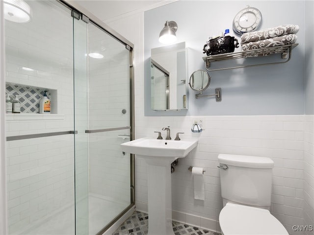 127 W St, Rutland, NY 13612 - full bath with a shower stall, toilet, tile walls, a wainscoted wall, and a sink