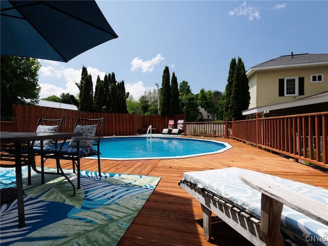 127 W St, Rutland, NY 13612 - view of swimming pool featuring a wooden deck and fence
