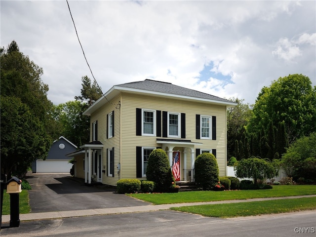 127 W St, Rutland, NY 13612 - view of front of house with an outdoor structure, a detached garage, and a front yard