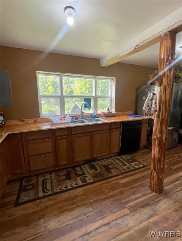 13209 Miller Ave, Sardinia, NY 14030 - kitchen featuring dishwasher, hardwood / wood-style flooring, a sink, brown cabinetry, and light countertops