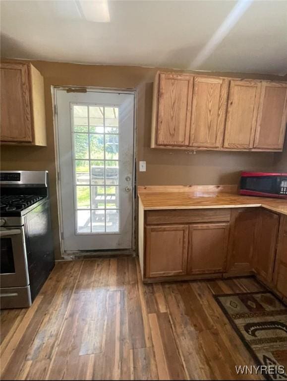 13209 Miller Ave, Sardinia, NY 14030 - kitchen featuring stainless steel gas range oven, wood finished floors, and light countertops