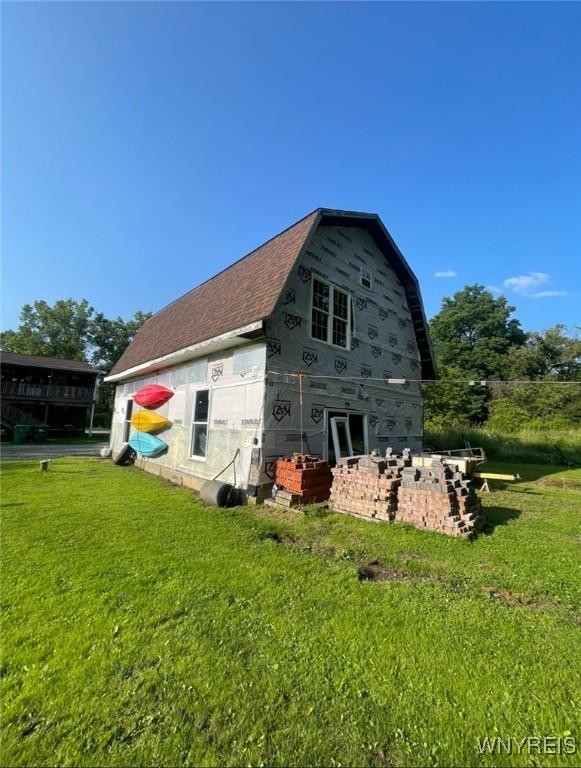 13209 Miller Ave, Sardinia, NY 14030 - rear view of property featuring a yard and roof with shingles