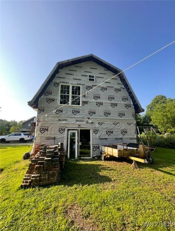 13209 Miller Ave, Sardinia, NY 14030 - back of property with a gambrel roof, a yard, and an outbuilding