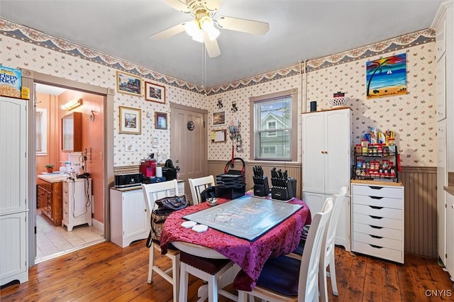 119 Charles Ave, Geddes, NY 13209 - dining area featuring wallpapered walls, a wainscoted wall, hardwood / wood-style floors, and a ceiling fan