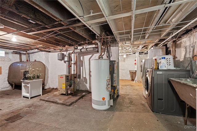 119 Charles Ave, Geddes, NY 13209 - below grade area with oil tank, washer and clothes dryer, water heater, and a heating unit