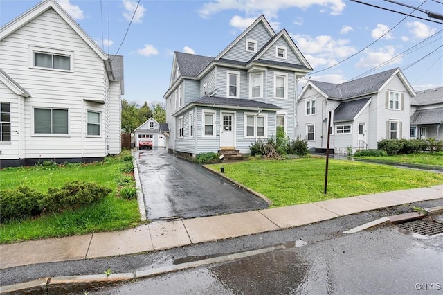 119 Charles Ave, Geddes, NY 13209 - view of front of home featuring an outdoor structure, a front lawn, entry steps, and a residential view