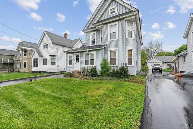 119 Charles Ave, Geddes, NY 13209 - view of front of property with driveway, an outdoor structure, a front lawn, a detached garage, and a residential view