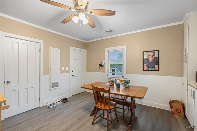 119 Charles Ave, Geddes, NY 13209 - dining room featuring wood finished floors, crown molding, ceiling fan, and baseboards