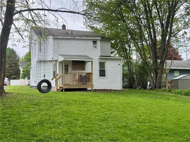 11 Gilbert St, Oneonta-City, NY 13820 - rear view of house featuring a yard and a chimney