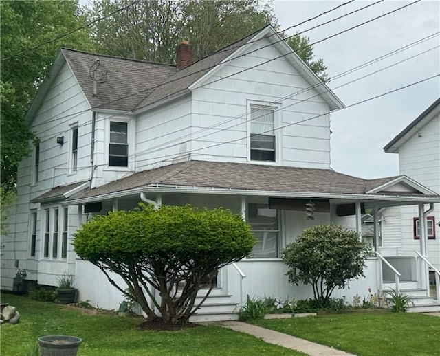 11 Gilbert St, Oneonta-City, NY 13820 - view of front of house featuring roof with shingles, a chimney, a front lawn, and covered porch