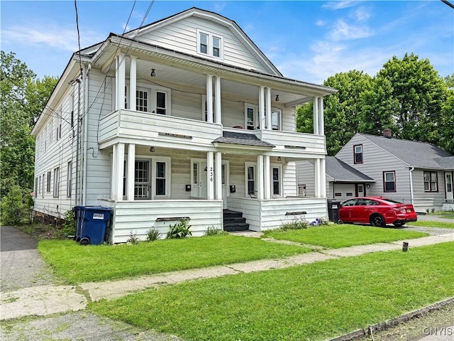 236 N Midler Ave, Syracuse, NY 13206 - view of front of home featuring covered porch, a front lawn, and a balcony