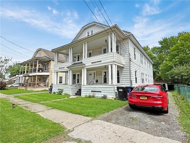 236 N Midler Ave, Syracuse, NY 13206 - view of front of home featuring covered porch, a balcony, and driveway