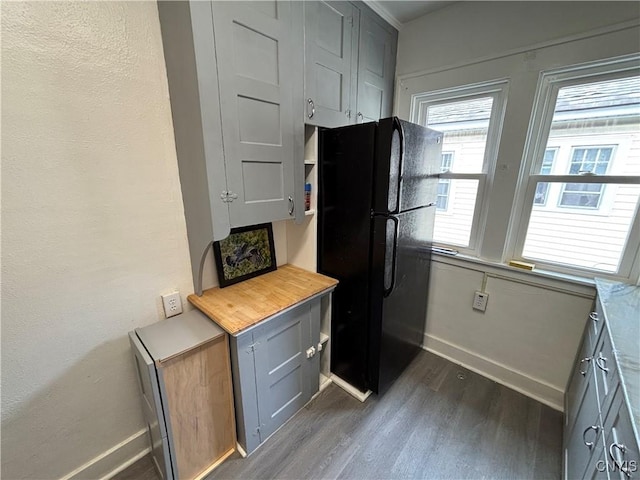 236 N Midler Ave, Syracuse, NY 13206 - kitchen featuring freestanding refrigerator, dark wood-type flooring, gray cabinetry, baseboards, and butcher block counters