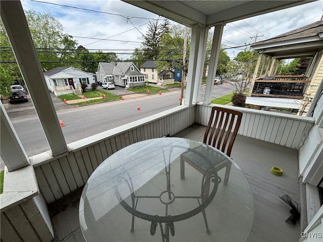 236 N Midler Ave, Syracuse, NY 13206 - sunroom featuring outdoor dining area and a residential view