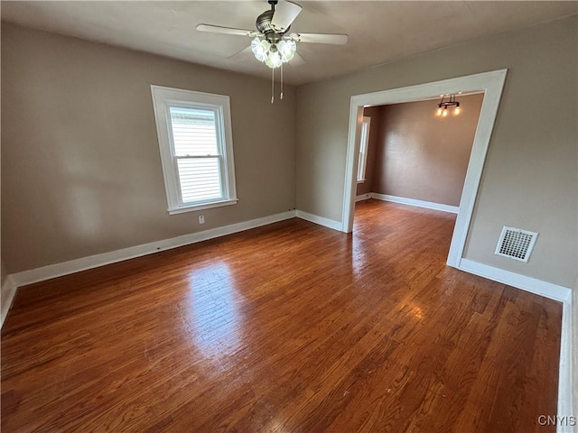 236 N Midler Ave, Syracuse, NY 13206 - unfurnished room featuring baseboards, wood finished floors, and ceiling fan