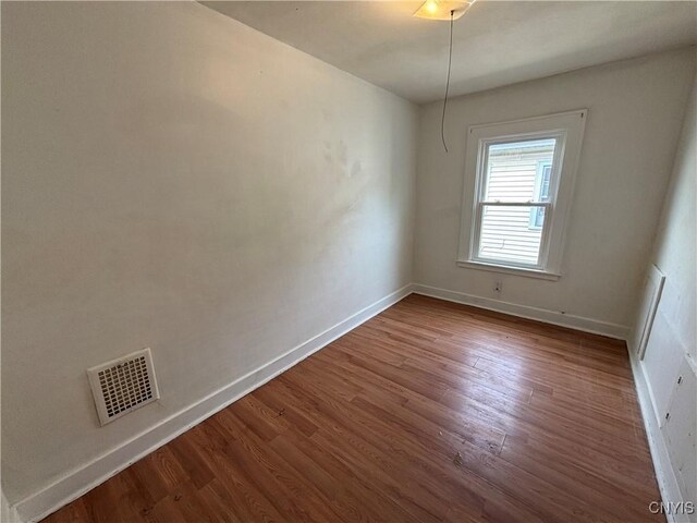 236 N Midler Ave, Syracuse, NY 13206 - unfurnished room with baseboards and wood finished floors