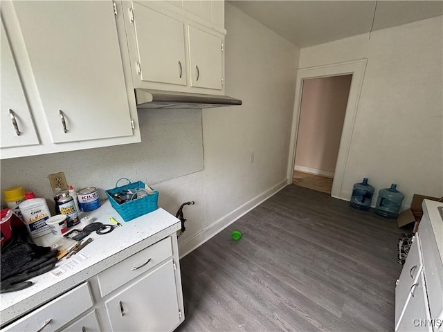 236 N Midler Ave, Syracuse, NY 13206 - kitchen with light countertops, under cabinet range hood, white cabinetry, dark wood-type flooring, and baseboards