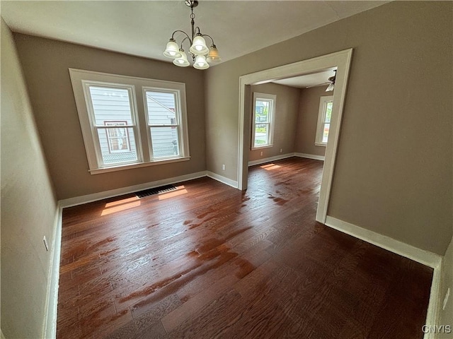 236 N Midler Ave, Syracuse, NY 13206 - spare room with dark wood-style floors, a chandelier, and baseboards
