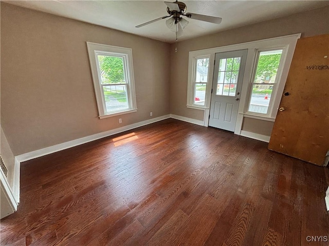 236 N Midler Ave, Syracuse, NY 13206 - unfurnished room featuring dark wood finished floors, healthy amount of natural light, baseboards, and ceiling fan