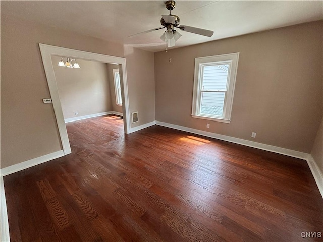236 N Midler Ave, Syracuse, NY 13206 - unfurnished room featuring dark wood finished floors, baseboards, and a ceiling fan