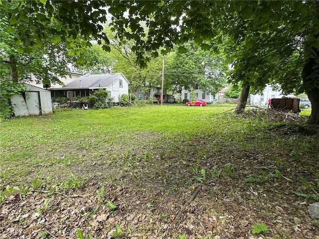 313 W 4th St, Elmira-City, NY 14901 - view of yard with a storage shed and an outbuilding