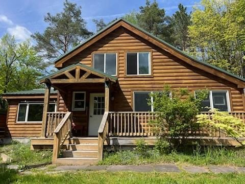 462 Winney Hill Rd, Oneonta-Town, NY 13820 - rear view of property featuring a porch