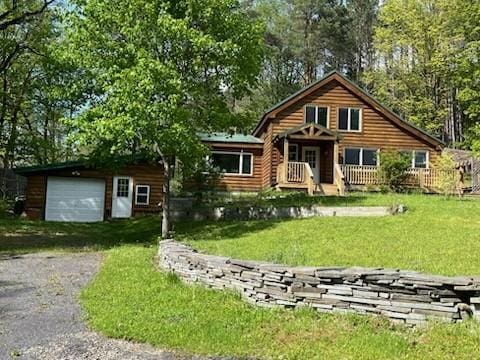 462 Winney Hill Rd, Oneonta-Town, NY 13820 - log home featuring asphalt driveway and a front yard