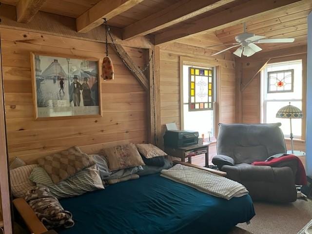 462 Winney Hill Rd, Oneonta-Town, NY 13820 - bedroom with wood ceiling, wood walls, beam ceiling, multiple windows, and carpet flooring