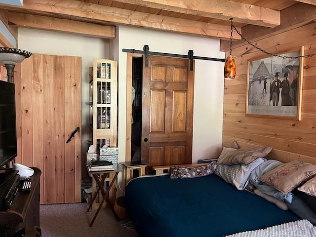 462 Winney Hill Rd, Oneonta-Town, NY 13820 - bedroom featuring a barn door, carpet flooring, wooden walls, and beamed ceiling