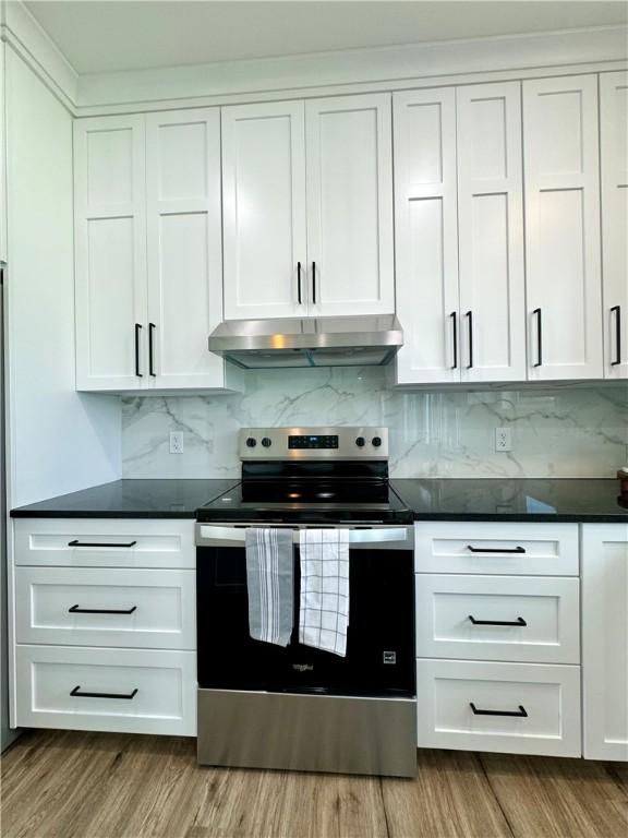 4 Brookwood Hills Dr, Big Flats, NY 14845 - kitchen featuring stainless steel electric stove, under cabinet range hood, wood finished floors, and white cabinets