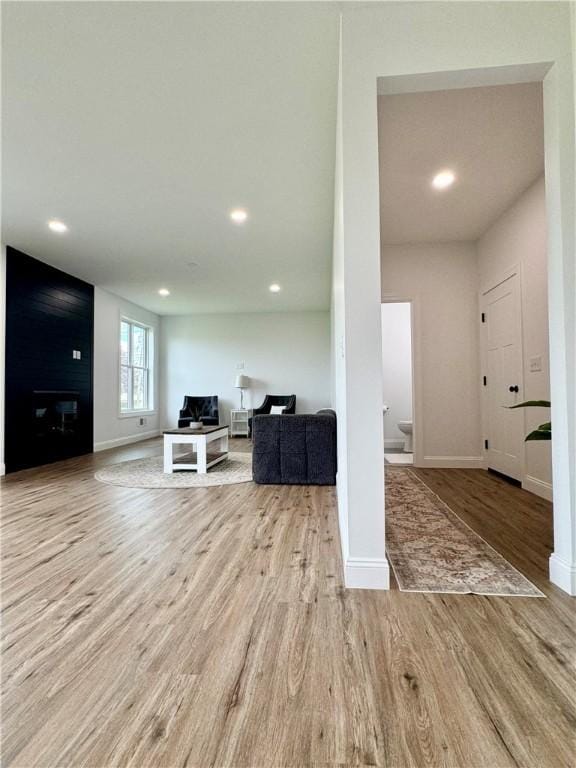 4 Brookwood Hills Dr, Big Flats, NY 14845 - living room featuring wood finished floors, baseboards, recessed lighting, and a fireplace