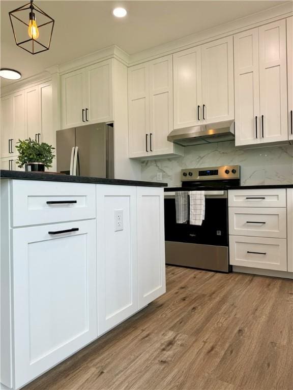 4 Brookwood Hills Dr, Big Flats, NY 14845 - kitchen with stainless steel appliances, under cabinet range hood, dark countertops, white cabinets, and recessed lighting