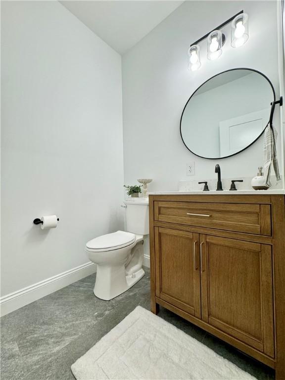 4 Brookwood Hills Dr, Big Flats, NY 14845 - bathroom featuring vanity, toilet, and baseboards