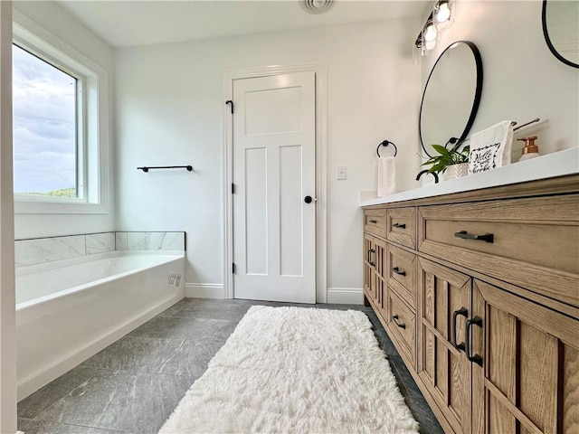 4 Brookwood Hills Dr, Big Flats, NY 14845 - full bath featuring vanity, a garden tub, and baseboards