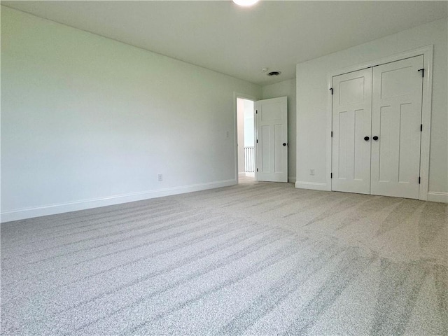 4 Brookwood Hills Dr, Big Flats, NY 14845 - unfurnished bedroom with carpet floors, baseboards, and a closet
